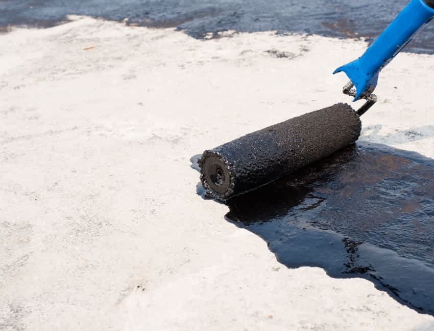 Floor Waterproofing - A Man Applying Liquid Waterproofing Sealant to Cement
