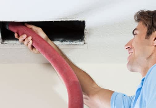 Mold Remediation Contractor New York - A Mold Removal Technician Testing the Air
