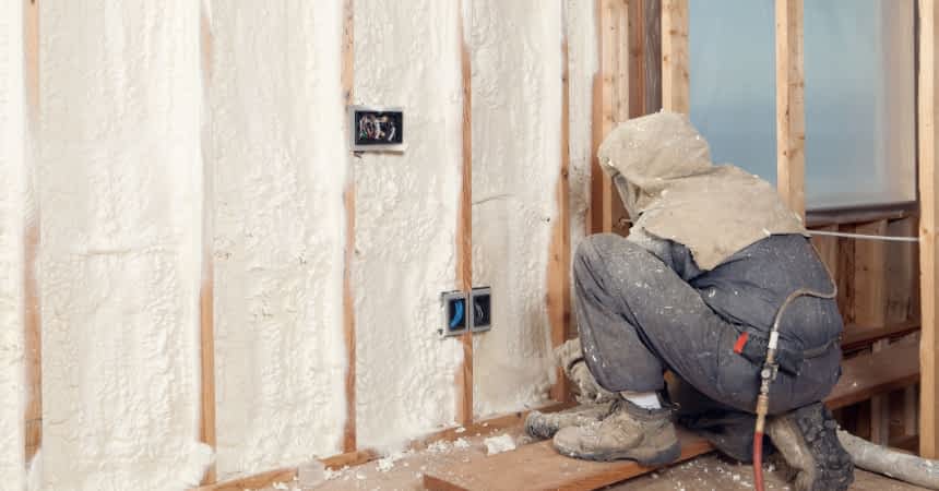 Types of Insulation Contractor New York - A Spray Foam Insulation Installer Installing Spray Foam on a Basement Wall