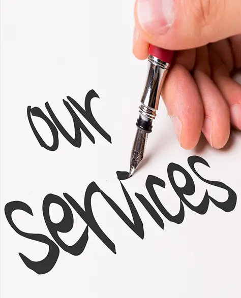 Zavza Seal: About Us - A Man’s Hand Writing “Our Services” on White Paper with a Calligraphy Pen