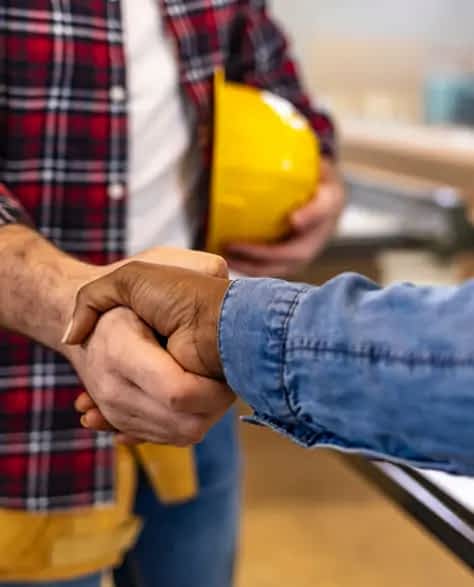 Zavza Seal: About Us - A Construction Worker Shaking Hands with Someone<br />
